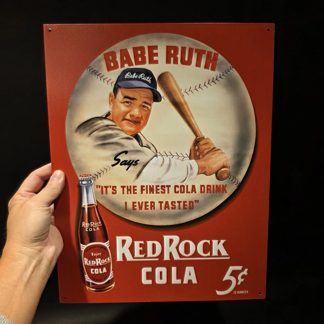 16" Babe Ruth Baseball Red Rock Cola Advertising Sign: 16" x 12 1/2" Red Rock Cola advertising sign featuring Babe Ruth, styled after early to mid-20th century soda advertising. Red Rock Cola, founded in 1885, used bold promotional imagery and celebrity