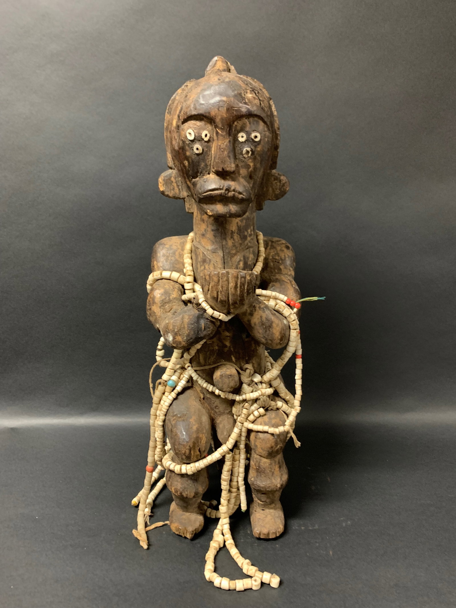 Carved Wood Fang Fetish Statue: Title: Carved Wood Fang Fetish Statue Description: African Tribal Art Carved Wood Fang Fetish Statue Date/Period: Late 20th Century Materials: Wood Size: 20.5" h x 6.5" w Reserve: $3,000.00 Shipping: