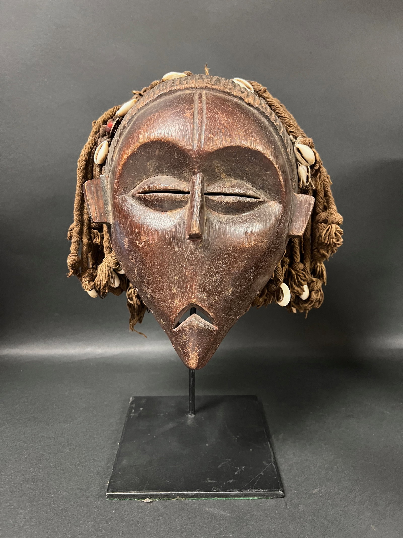 Carved Wood Chokwe With Display Stand: Title: Carved Wood Chokwe With Display Stand Description: African Tribal Art Carved Wood Chokwe Mask with Dipslay Stand Date/Period: Late 20th Century Materials: Wood Size: 14" h x 9" w Reserve: