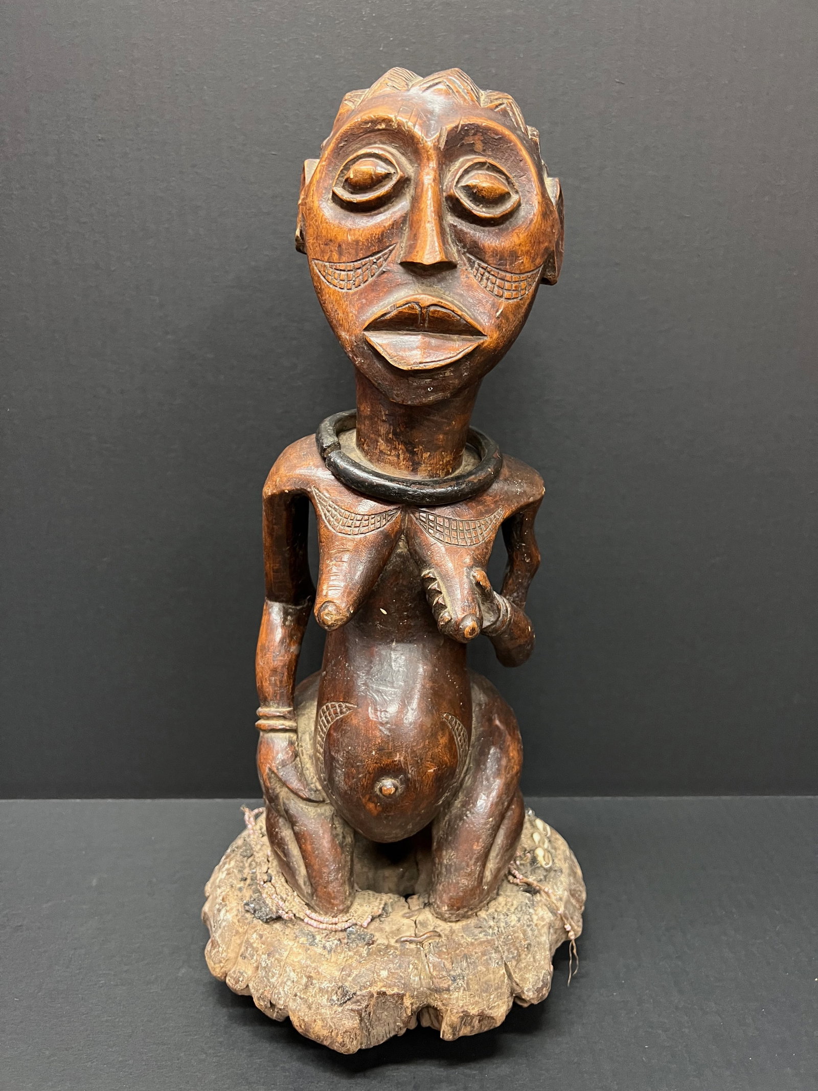 Carved Wood Tabwa Statue: Title: Carved Wood Tabwa Statue Description: African Tribal Art Carved Wood Tabwa Statue Date/Period: Late 20th Century Materials: Wood Size: 15.25" h x 5.75" w Reserve: $600.00 Shipping: Domestic: F