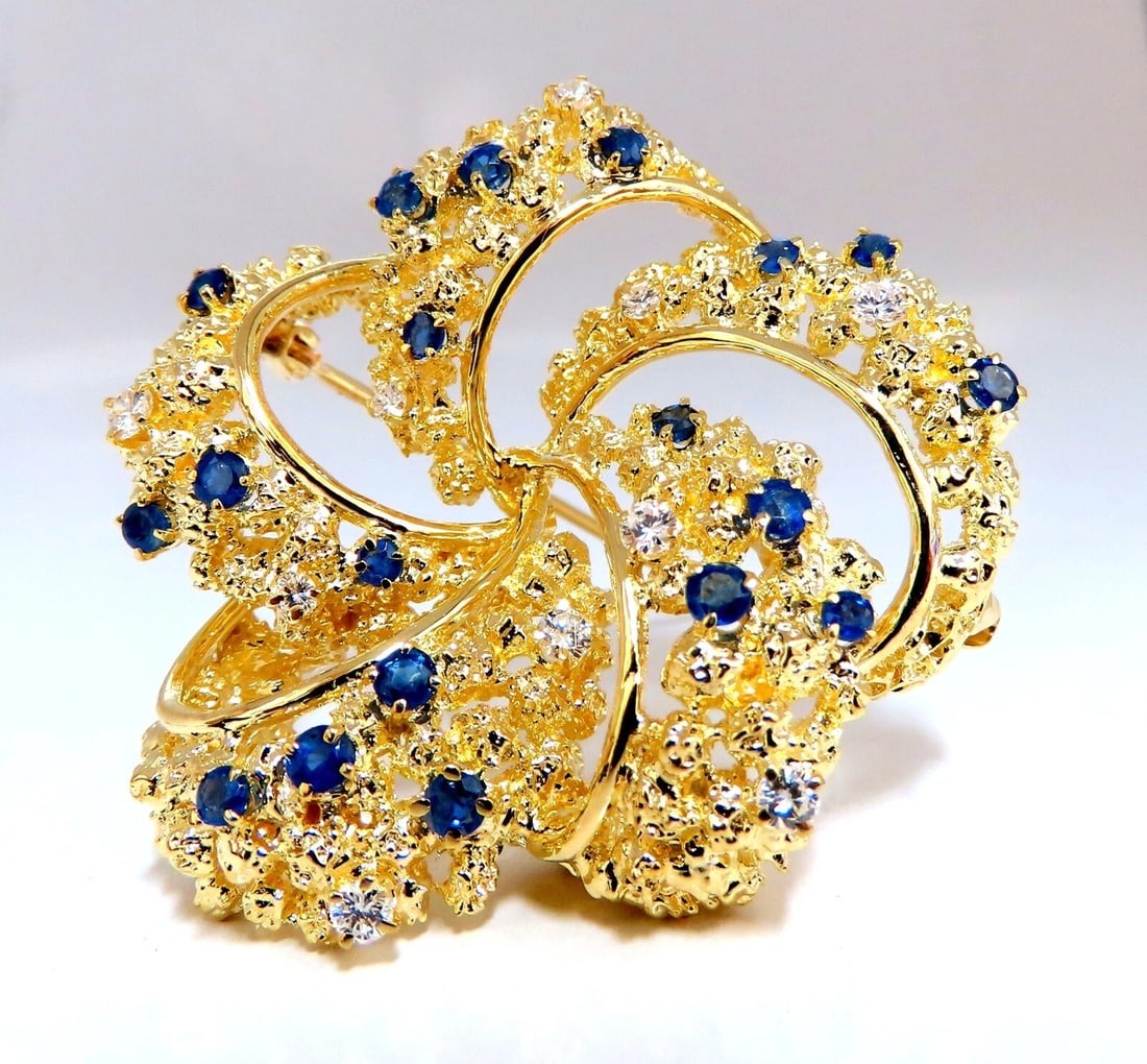 Swirling 18kt Gold Natural Sapphire Diamonds Pin**: Title: Swirling 18kt Gold Natural Sapphire Diamonds Pin** Description: Swirling 3D Crest Pin Very Well Made .50ct natural diamonds G-color Vs2 Clarity .80ct natural sapphire 1.8 x 1.6 inch Handmade 18