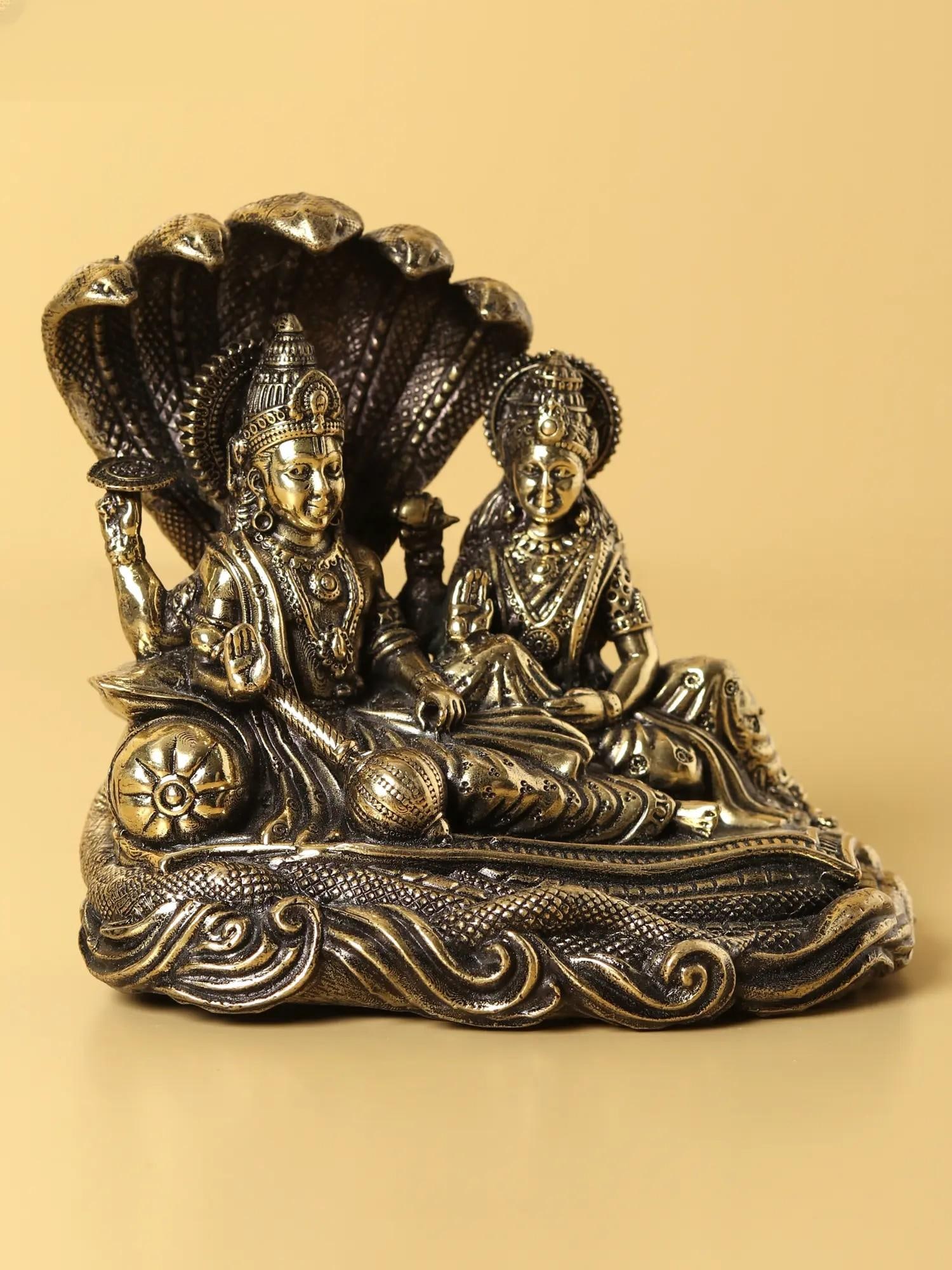 Small Superfine Lakshmi Narayana Brass Statue Seated on Sheshnag (Multiple Sizes): Title: Small Superfine Lakshmi Narayana Brass Statue Seated on Sheshnag (Multiple Sizes) Description: Lord Vishnu resides in Kshirsagar, also known as Thirupaarakadal (the ocean of milk), where he res
