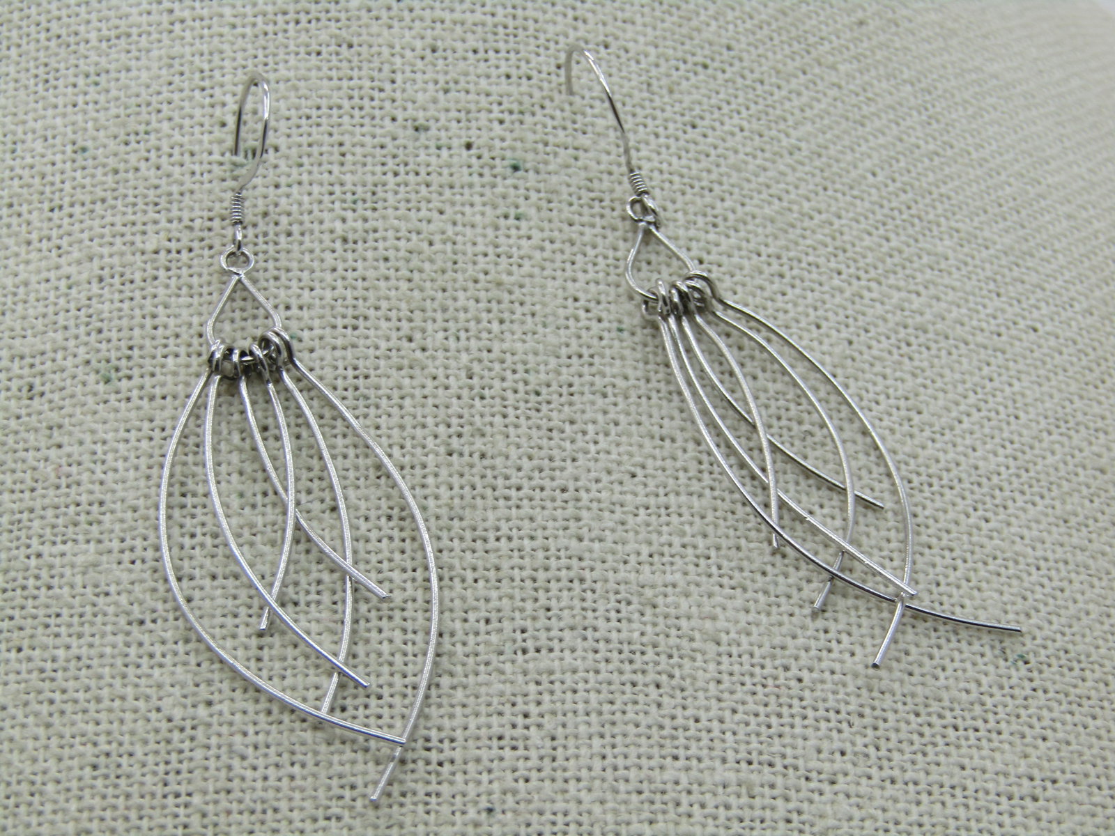 Vintage Sterling 6 Curved Strand Drop Earrings, Pierced, 2.5": Vintage Sterling 6 Curved Strand Drop Earrings, Pierced, 2.5". Late 1900's and appx. 2.36 grams. Six wire strands that curve and drop. They are appx. 2.5" long from the curve on the hook. Marked .925 