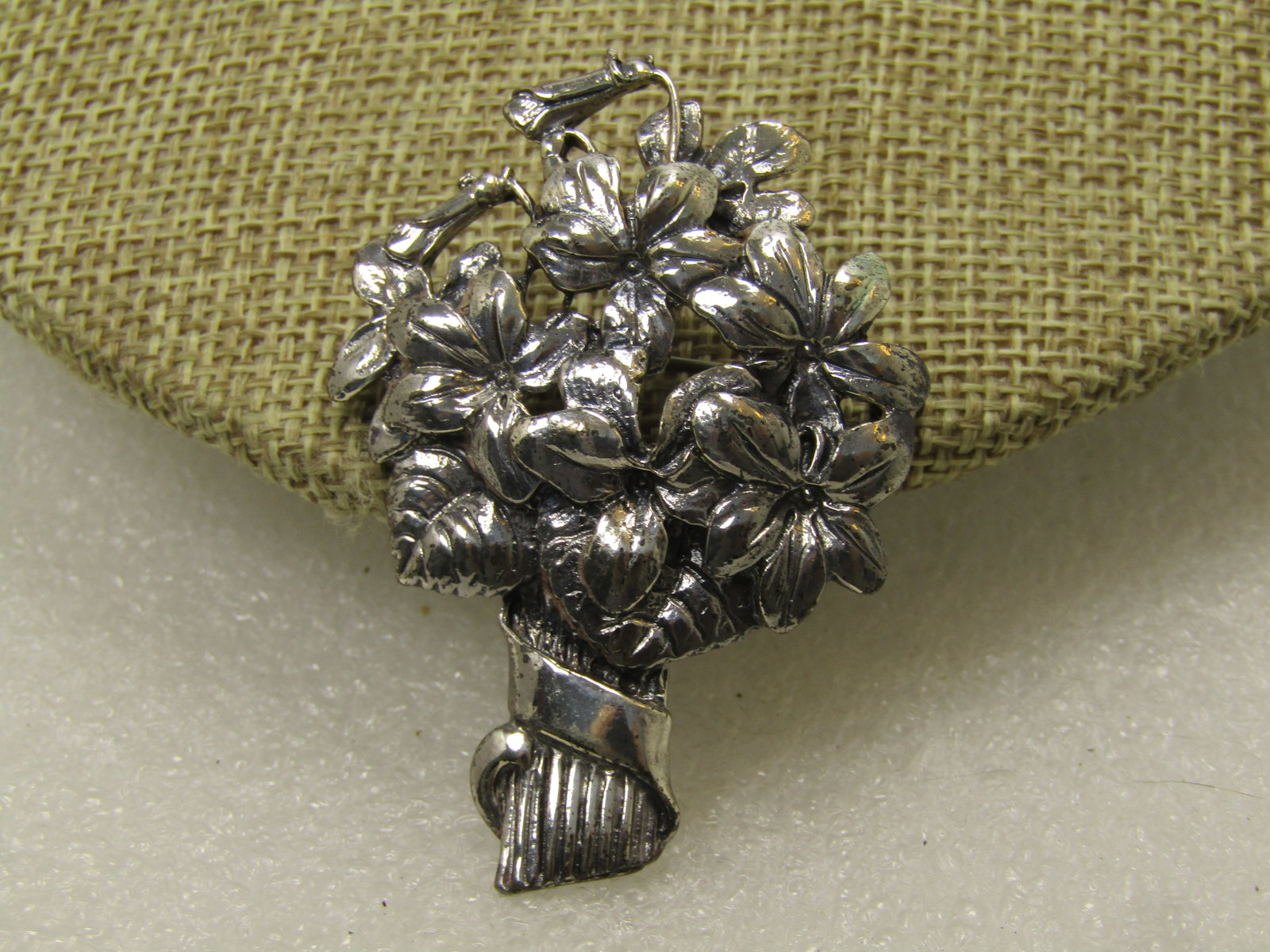 Vintage Sterling Floral Boquet Brooch, 1940's, Signed ING: Vintage Sterling Floral Boquet Brooch, 1940's, Signed ING. This is marked Sterling and signed with ING. The brooch has blossoms and leaves with th stems having a ribbon-like wrap around the stems. It 