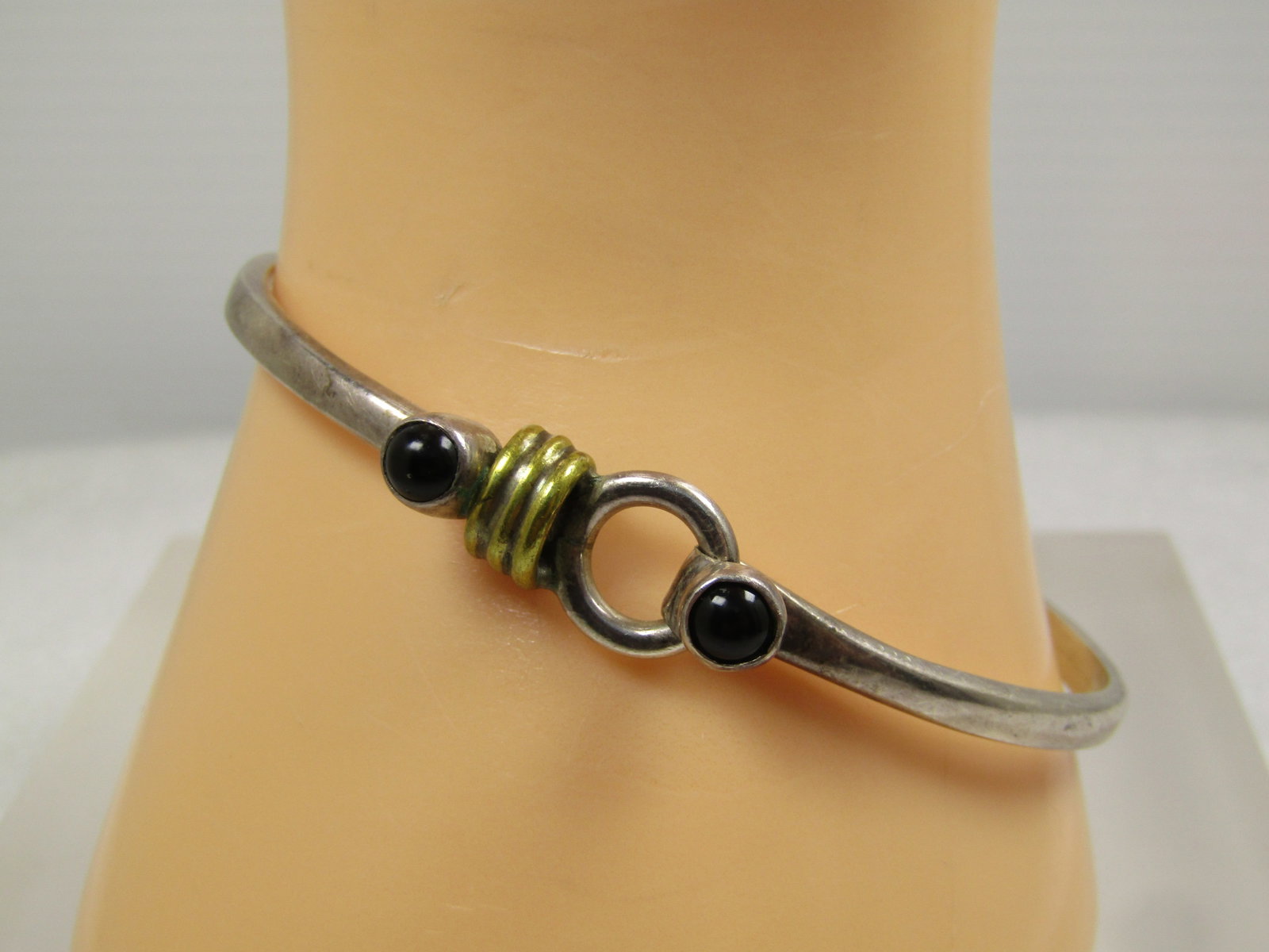 Vintage Sterling, Onyx and Brace Cuff Bracelet, Top Clasp, Signed TS, Later 1900's.: Vintage Sterling, Onyx and Brace Cuff Bracelet, Top Clasp, Unisex, Signed TS-21, which I believe is a Mexican mark. it is not marked Mexico. It has a triple brass band accet at the clasp - that is cal