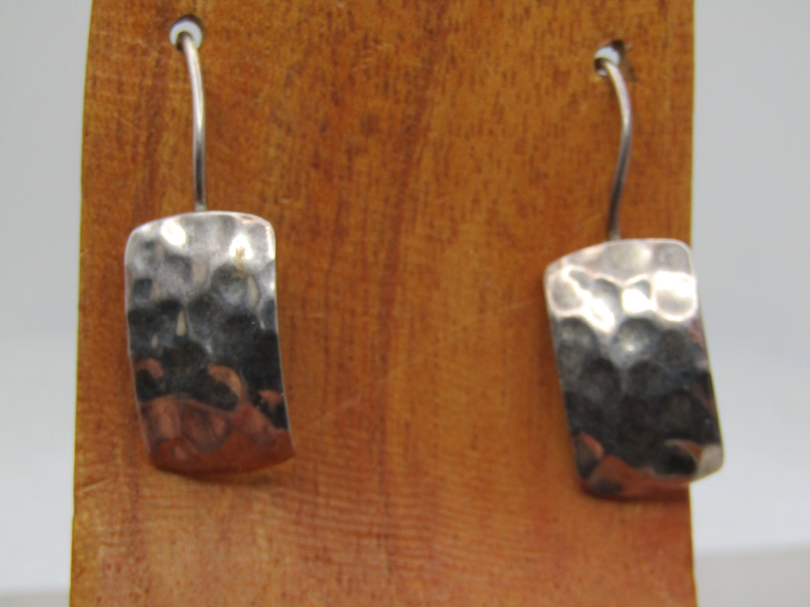 Vintage Sterling Silpada Hammered Earrings, Pierced, 1990's-2000's: Vintage Sterling Silpada Hammered Earrings, Pierced, 1990's-2000's. These have a hammred slightly curved rectangular piece that is attached to the long hook post. The earrings are appx. 1.25" long fro