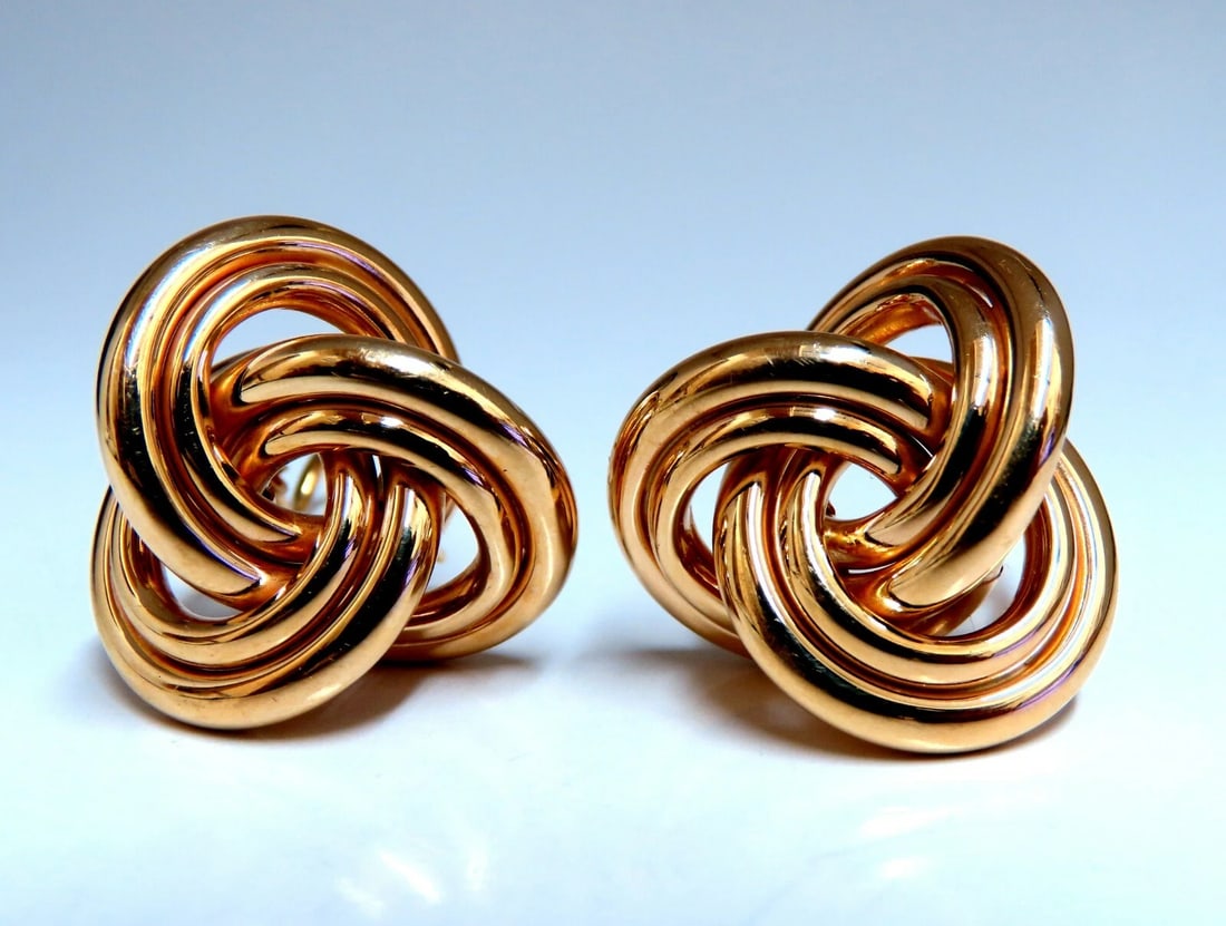 14kt Gold Textured Interlocking Tri Tubular Clip Earrings**: Title: 14kt Gold Textured Interlocking Tri Tubular Clip Earrings** Description: Tri Loop Interlocking Tubular Crest Textured Clip Earrings Measurements: .91 x .91 Inch Depth: .46inch Comfortable