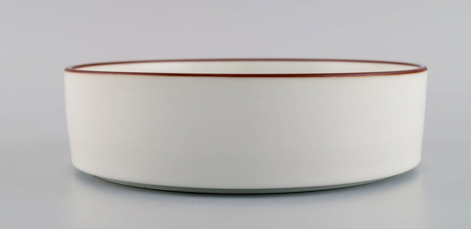 Anne Marie Trolle for Royal Copenhagen. Brown Domino bowl in hand-painted porcelain. Dated - 4