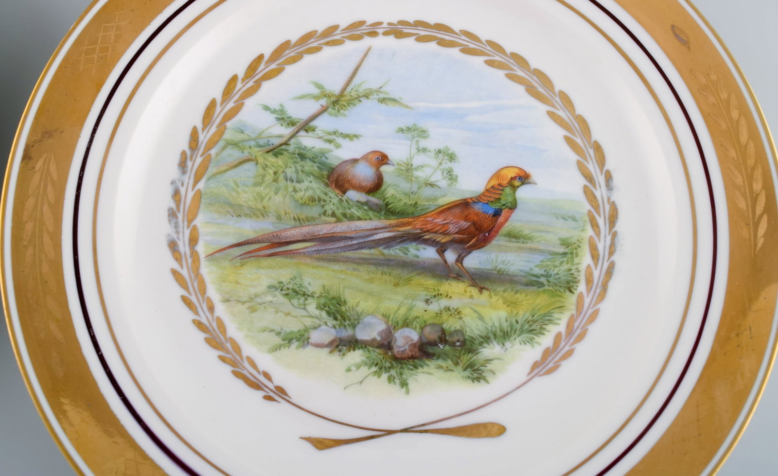 Royal Copenhagen. Set of five large dinner / decoration plates with hand painted bird motifs. Dated - 2