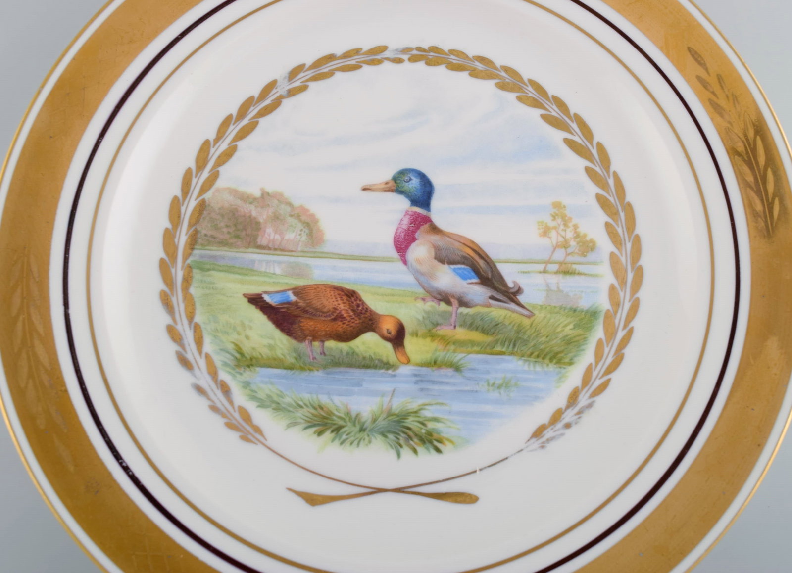 Royal Copenhagen. Set of five large dinner / decoration plates with hand painted bird motifs. Dated - 3