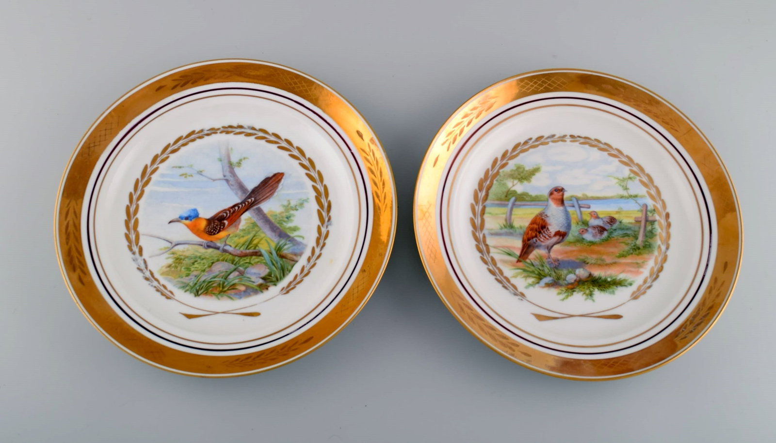 Royal Copenhagen. Set of five large dinner / decoration plates with hand painted bird motifs. Dated - 5