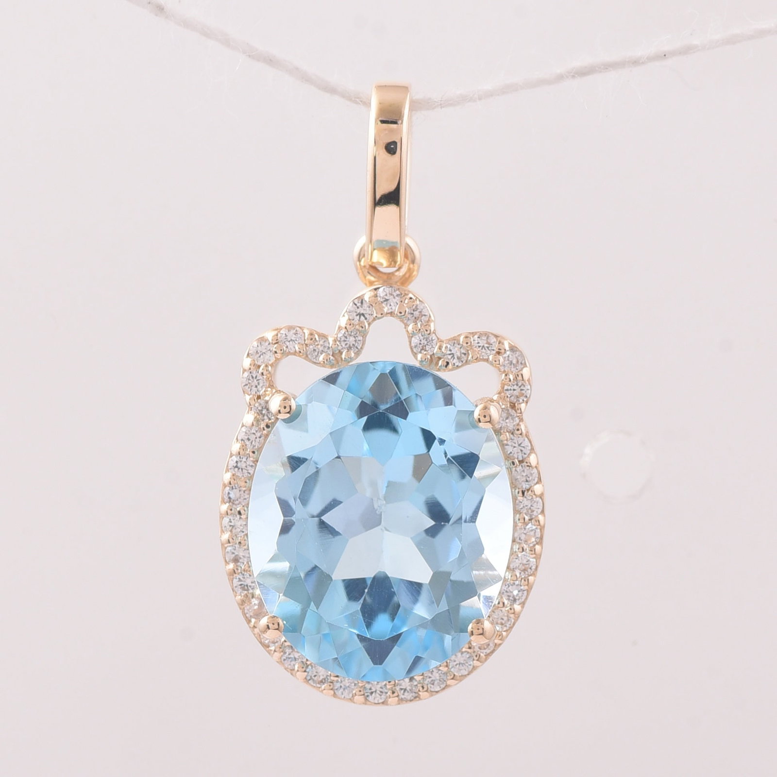 4.64 Ct Oval Blue Topaz 9K Gold Pendant