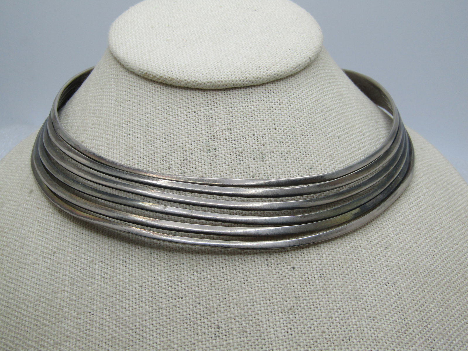 Vintage Six Strand Silver Cuff Necklace, 13.5", Plated, 1970's-1980's: Vintage Six Strand Silver Cuff Necklace, 13.5", Plated, 1970's-1980's. Tapered and angle townward at the font and it is appx. 1" tall. It gets more straight up as it goes around at the back of the nec