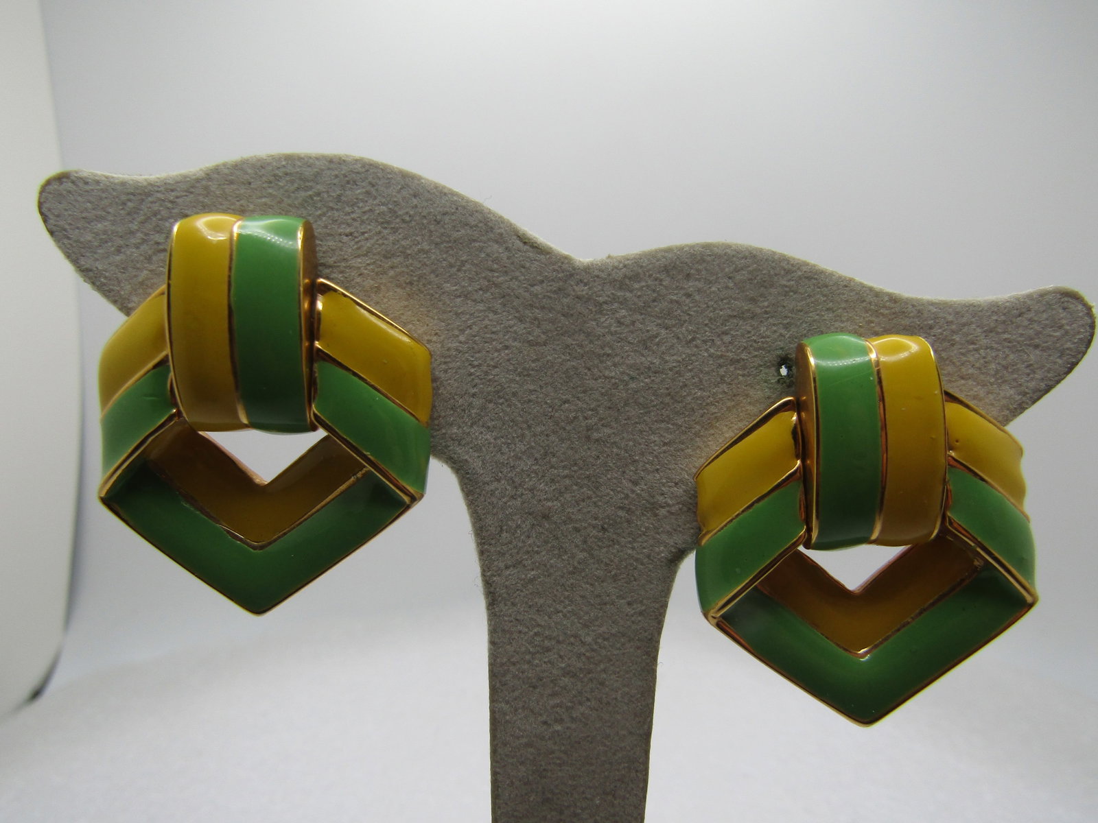 Vintage Enameled Yellow/Green Earrings, Swivel Clips, 1960's-1970's: Vintage Enameled Yellow/Green Earrings, Swivel Clips, 1960's-1970's. These have a band of yellow and green enameleding on a slightly domed surface with gold tone divider lines and edges. The comfort c