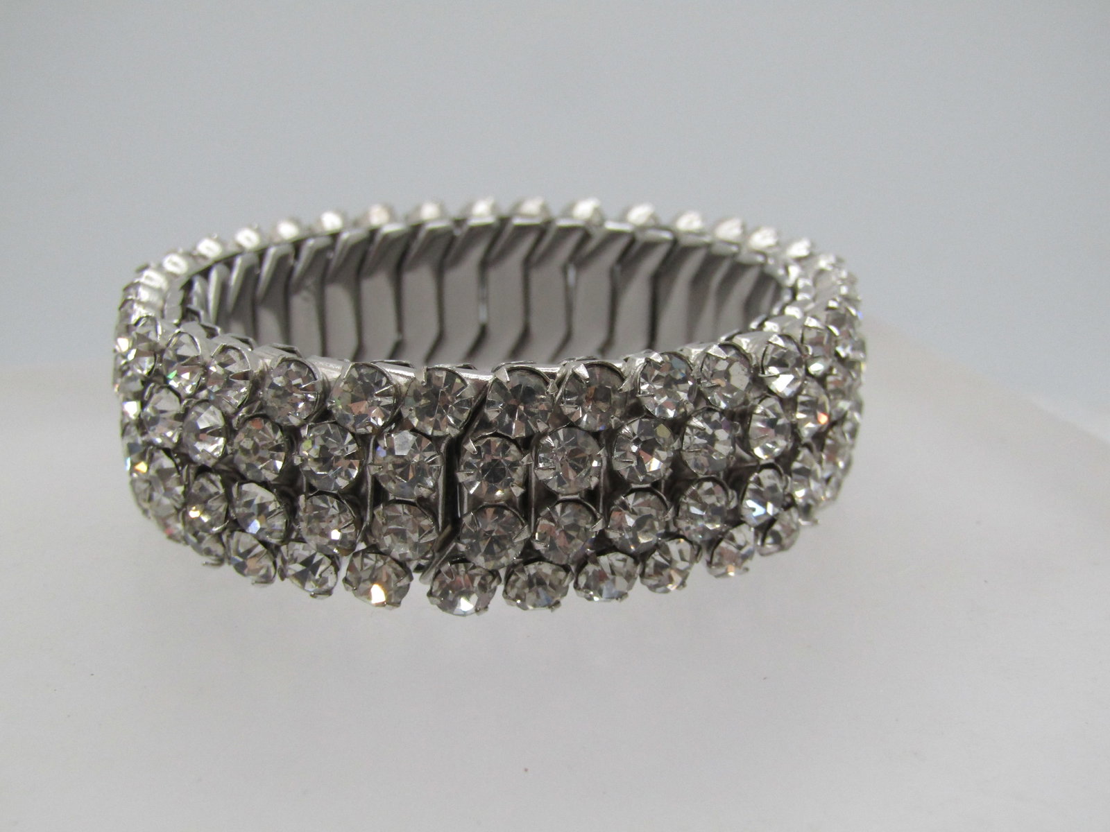 Vintage Rhinestone Expanding Bracelet, Signed AirFlex, 5"-8". 1950's.: Vintage Rhinestone Expanding Bracelet, Signed AirFlex, Made in USA, four rows of stones, silver tone, and appx. 5/8" wide. Age is appx. 1950's. Very nicely made and in very good condition. Best for wr