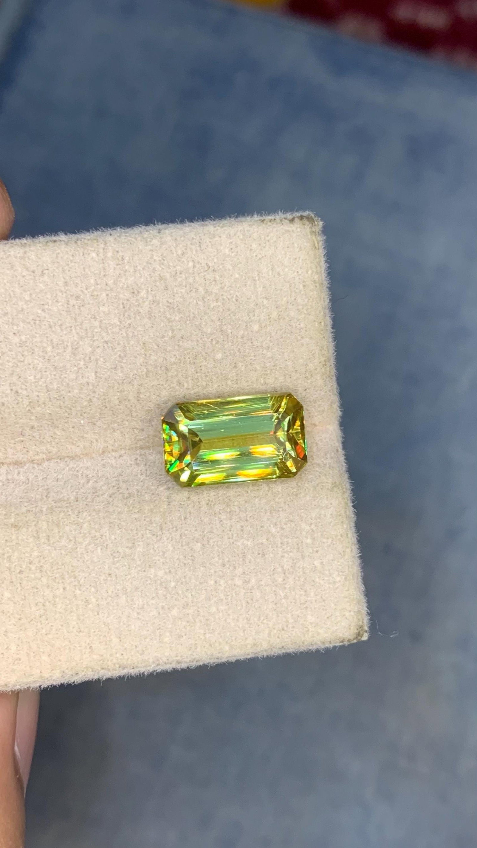 Emerald Cut Yellow Sphene Gemstone: 3.40 Carat Titanite: Title:Emerald Cut Yellow Sphene Gemstone: 3.40 Carat Titanite Description:Materials: Gemstone: Sphene Carat weight: 3.40 This stunning full fire sphene titanite loose gemstone features a classic Emera