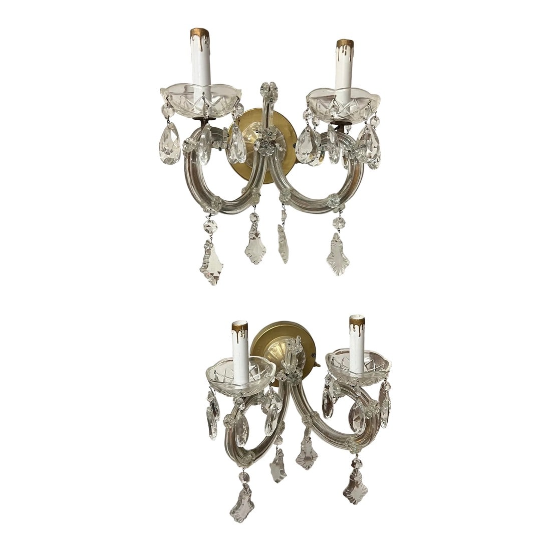 1940s Italian Crystal Wall Sconces - a Pair: Pair of 1940s Viennese crystal 2 light Wall Sconces in Maria Theresa Design. It had a 5" diameter base attached to the wall with 2 holes for screws and a button for turning the light on and off. These