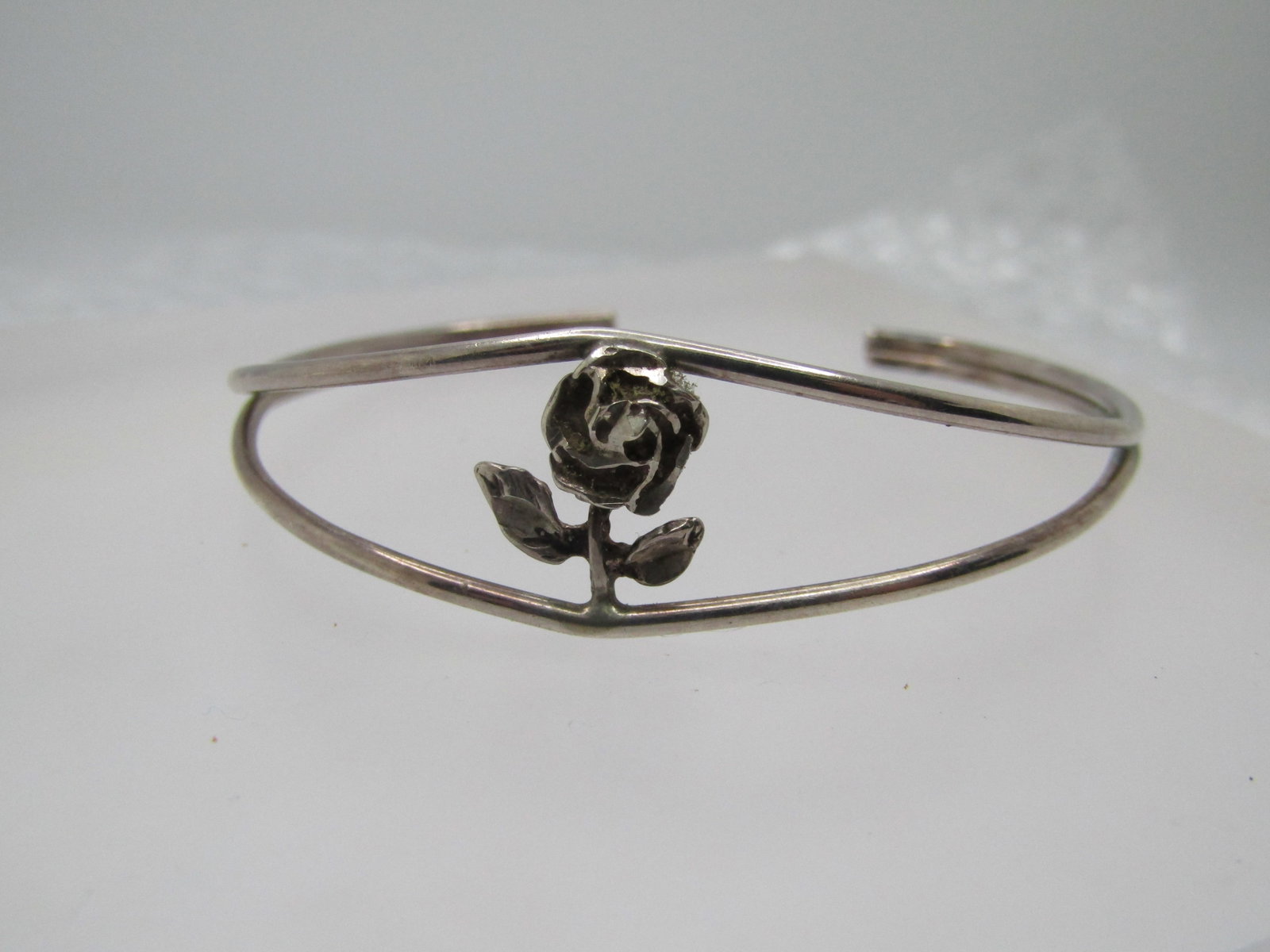 Vintage Sterling Rose Cuff Bracelet, 7", Signed: Title: Vintage Sterling Rose Cuff Bracelet, 7", Signed Description: Vintage Sterling Rose Cuff Bracelet, 7", Signed with an unknown mark. The opening at the back of the wrist is appx. 1-3/8" which is