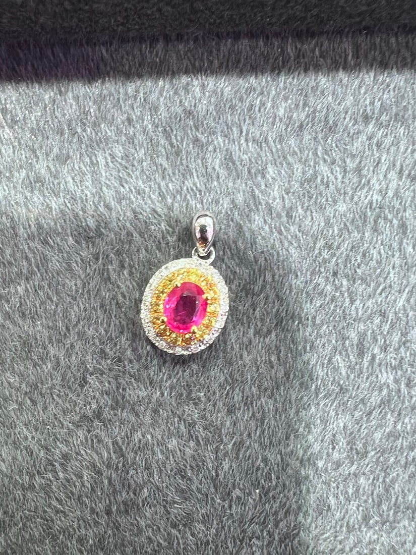 18K Gold Natural Pink and Blue Sapphire Pendant: Title: 18K Gold Natural Pink and Blue Sapphire Pendant Description: This pendant is meticulously set in 18K gold, featuring natural pink and blue sapphires that exude a rich golden and cool white