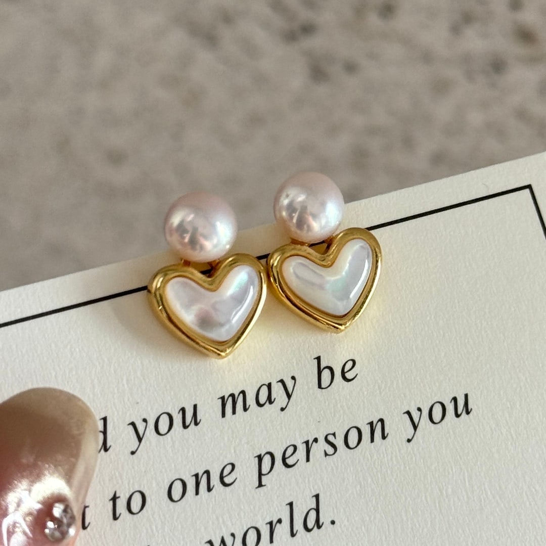 Natural Freshwater Pearl Earrings: Title: Natural Freshwater Pearl Earrings Description: These earrings feature high-quality natural freshwater pearls, measuring 6-7MM, set in material. The natural curvature of the pearls complements