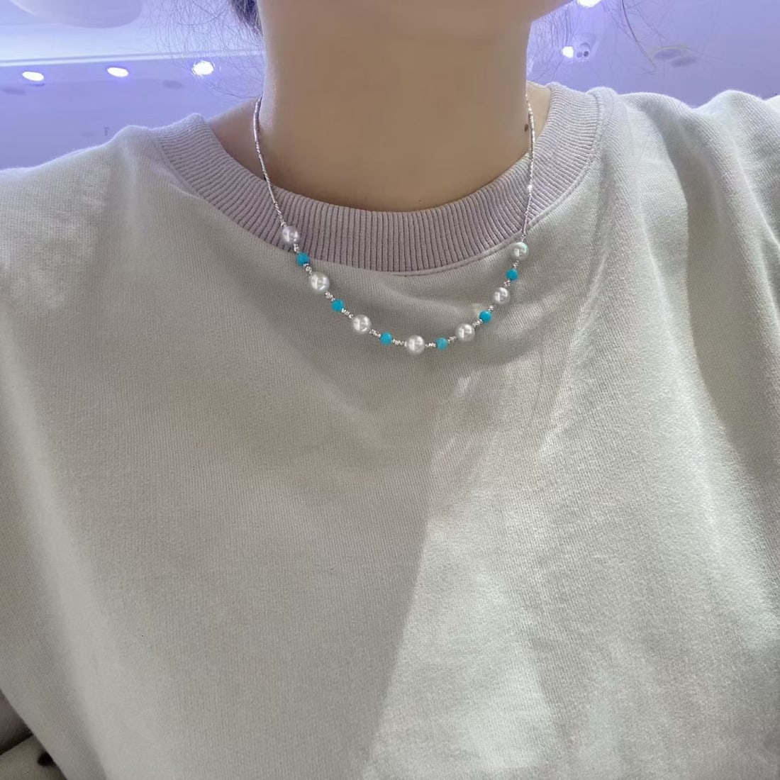 Natural Seawater Akoya Necklace: Title: Natural Seawater Akoya Necklace Description: This Natural Seawater Akoya Necklace features a unique translucent blue hue, exuding an inherent cool elegance. The large diameter pearls emit a