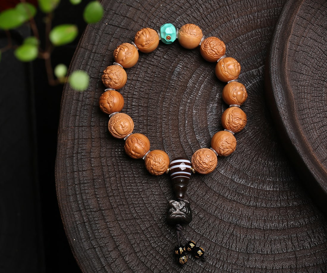 Natural Monkey Head Walnut Bracelet: Title: Natural Monkey Head Walnut Bracelet Description: This bracelet is crafted from natural monkey head walnut, each piece meticulously selected to ensure purity and flawlessness. Paired with