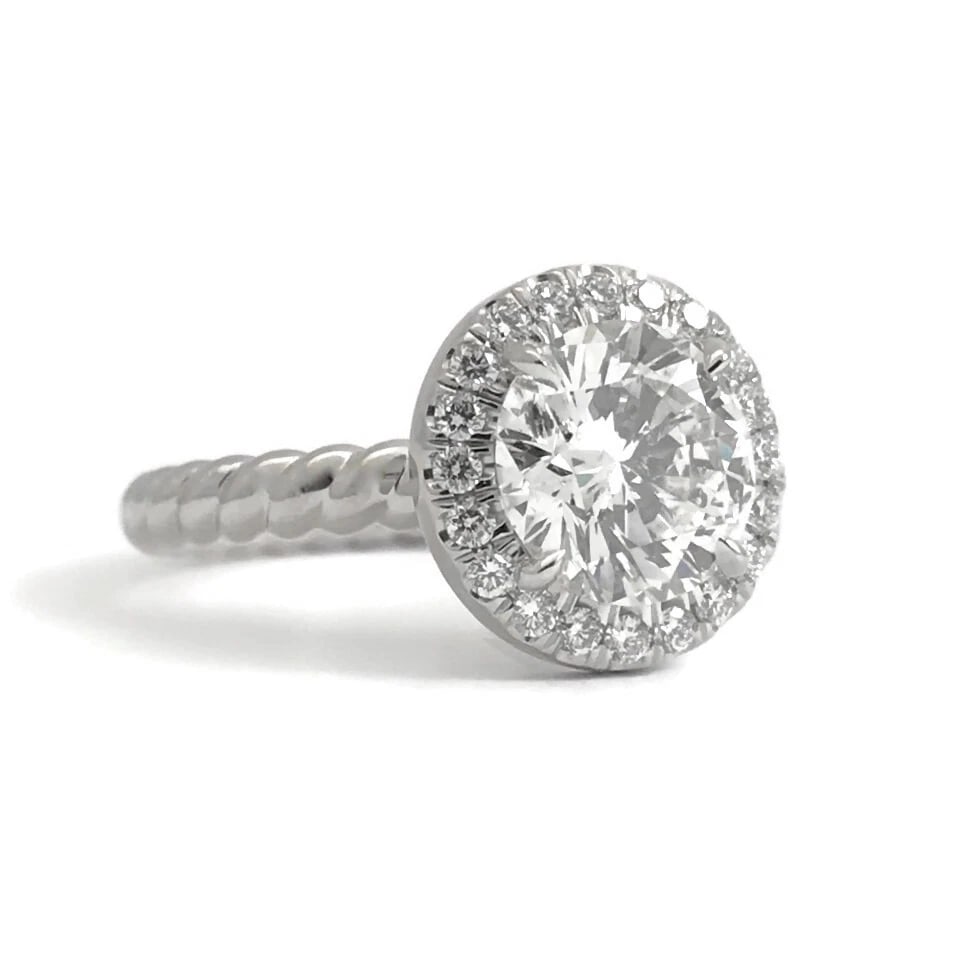 GIA Round Halo Diamond Platinum Engagement Ring 1.76 CTW, 6.72 Grams: GIA Round Halo Diamond Platinum Engagement Ring 1.76 CTW, 6.72 Grams This ring is gorgeous! A sparkly engagement ring she will love forever! Please let us know if you have any questions. Diamonds: 1.7