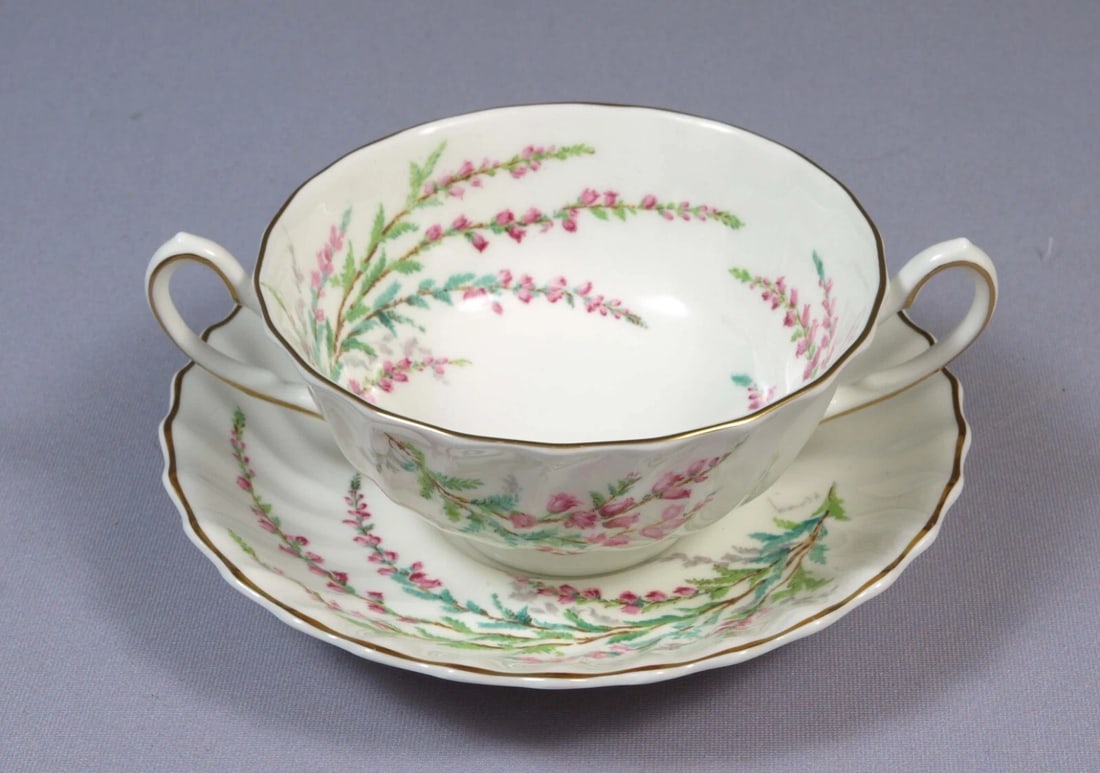Artist Signed Royal Doulton BELL HEATHER Cream Soup Bouillon Cup Bowl Saucer: This is a gorgeous Bone china Cream Soup Bowl and Saucer set, from the Bell Heather (H4927) pattern by Royal Doulton, Made in England. This pattern has been discontinued, it was originally manufacture