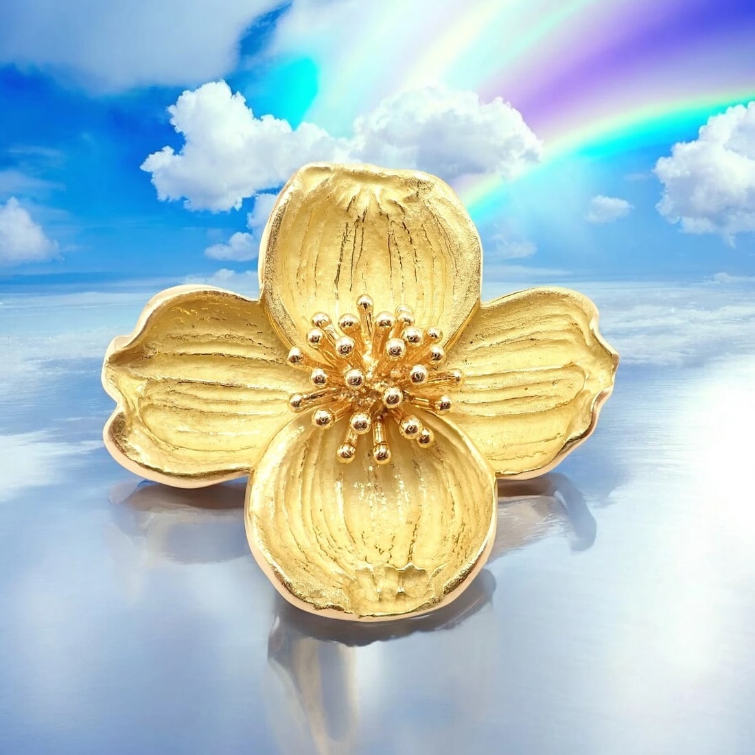 Authentic! Tiffany & Co. 18k Yellow Gold Dogwood Flower Pin Brooch: This elegant Tiffany & Co. Dogwood Flower brooch is crafted in rich 18k yellow gold. Featuring beautifully textured petals and a detailed stamen center, it captures the natural grace of the dogwood bl