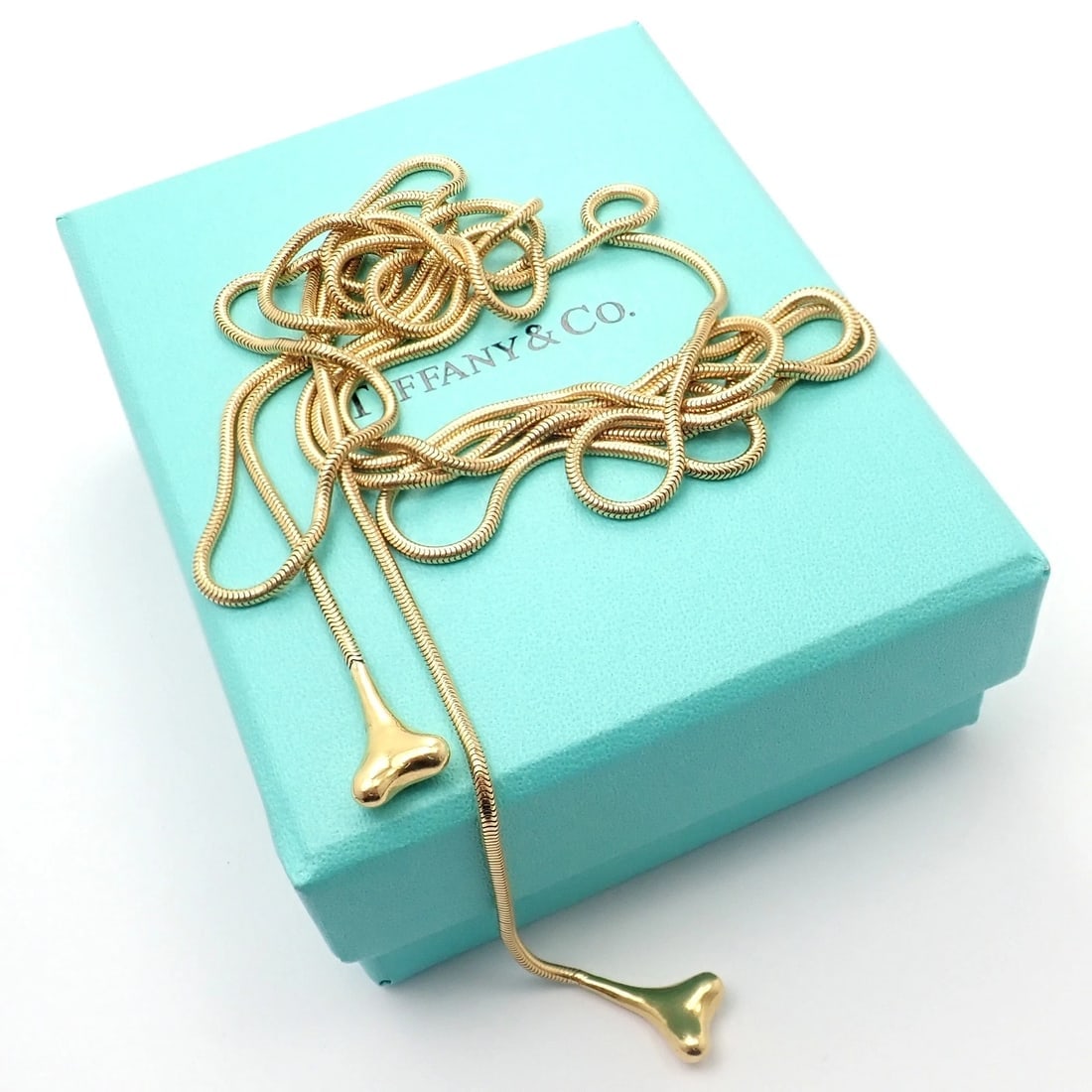 Authentic! Vintage Tiffany & Co 18k Yellow Gold 51" Extra Long Ginkgo Necklace: Celebrate nature’s delicate beauty with this exquisite Vintage Tiffany & Co 18k Yellow Gold Ginkgo Necklace. Measuring 51 inches, its intricate leaf motifs exude classic elegance and distinctive