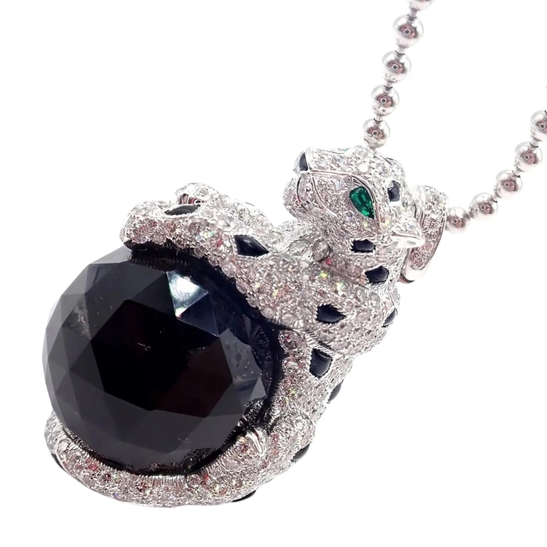Panthere de Cartier Panther 18k Gold Diamond Emerald Onyx Pendant Necklace Paper: Panthere de Cartier Panther 18k Gold Diamond Emerald Onyx Pendant Necklace Paper About This Piece: The Panthère de Cartier Panther Pendant Necklace is a striking embodiment of Cartier's iconic fe