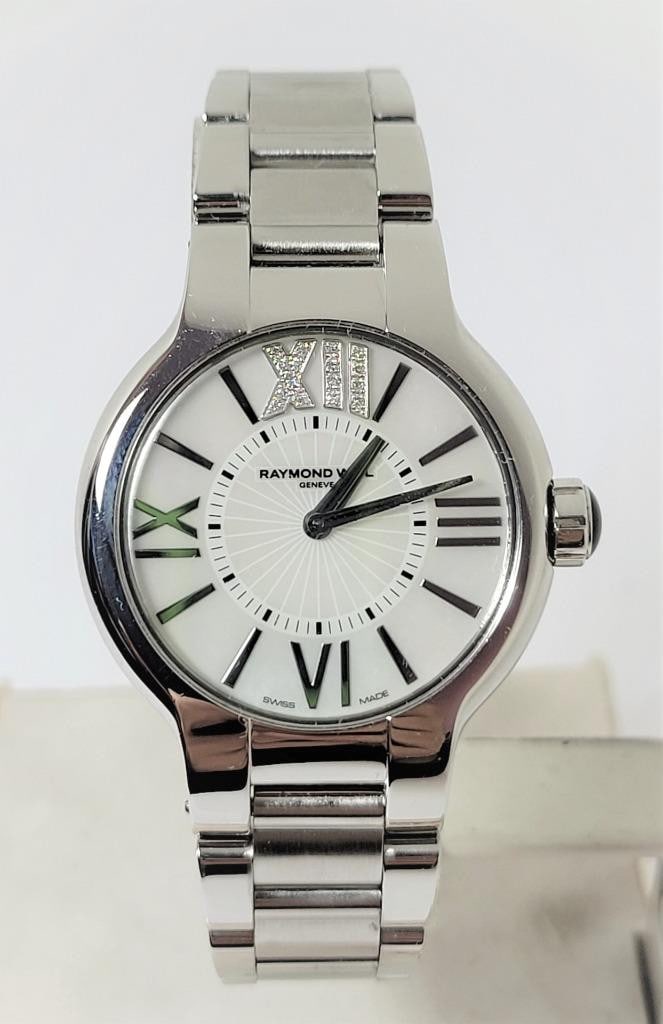 S/Steel RAYMOND WEIL Noemia Ladies Quartz Watch Diamonds on 12 Ref 5932* EXLNT: S/Steel RAYMOND WEIL Noemia Ladies Quartz Watch Diamonds on 12 Ref 5932* EXLNT ?? This Ladies Raymond Weil watch is Swiss made. Great present for yourself or someone you love! * Stainless steel case