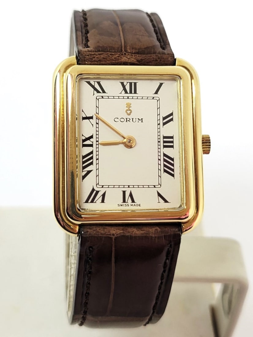 Vintage Solid 18k Yellow Gold Unisex CORUM 27218 Winding Watch* EXLNT: Vintage Solid 18k Yellow Gold Unisex CORUM 27218 Winding Watch* EXLNT??? This Unisex Corum watch is Swiss made. Great present for yourself or someone you love! * Solid 18k yellow gold case and back * 