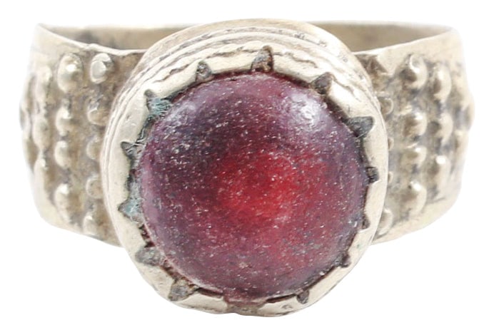 EASTERN EUROPEAN GYPSY RING, SIZE 6 3/4: 19th century. White metal band, 4.5mm, with pellet motif shoulders. Roped bezel with red “stone”. Good quality for these with a balance of Gypsy flare and European class. •Celtic