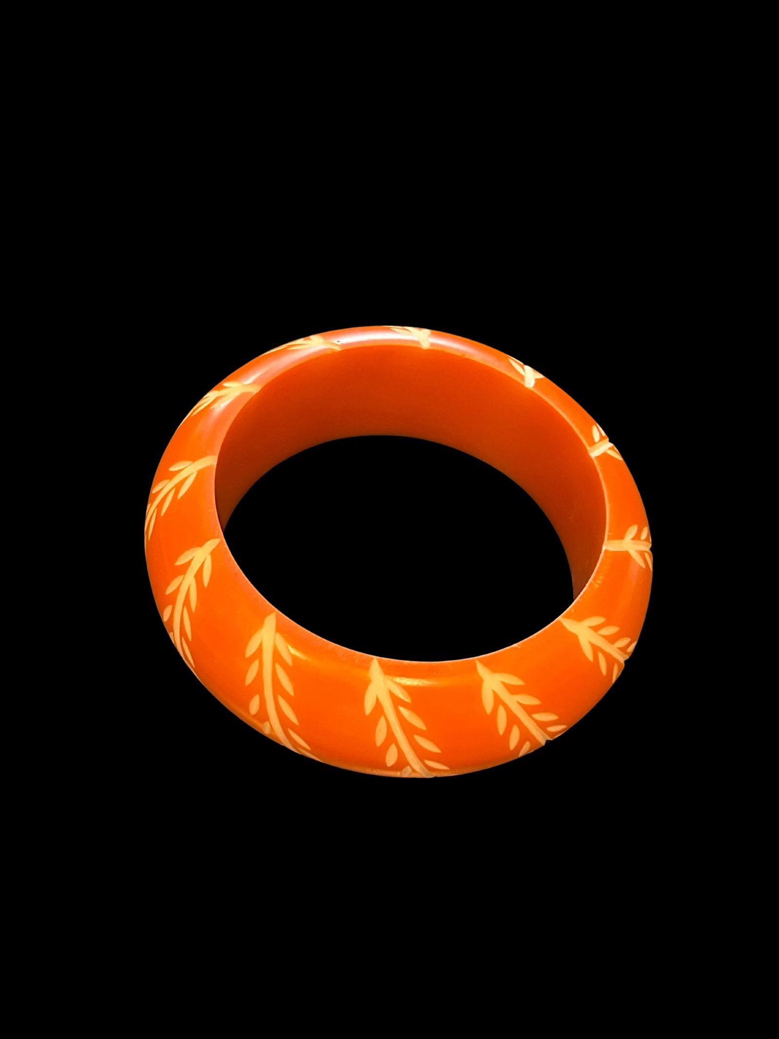 Vintage Bakelite Bangle Bracelet in Chunky Orange With Carved White Floral and Leaf Design, Domed - 2