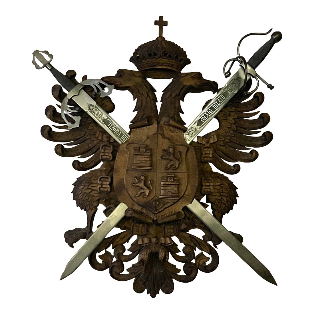 Vintage Carved Wood Coat of Arms of the Holy Roman Empire With Swords: The design is based on the coat of arms of Toledo, Spain, which was granted by Charles V, Holy Roman Emperor. Carved with a crowned Imperial double headed eagle supporting a shield with the quartered