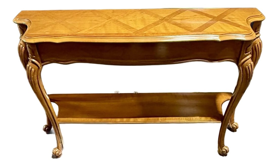 Mid 20th Century Louis XV French Provincial Console Table: The most striking feature of this table is its tabletop, which boasts a sophisticated patterned inlay. This marquetry design creates a geometric grid, adding depth and a bespoke feel. The