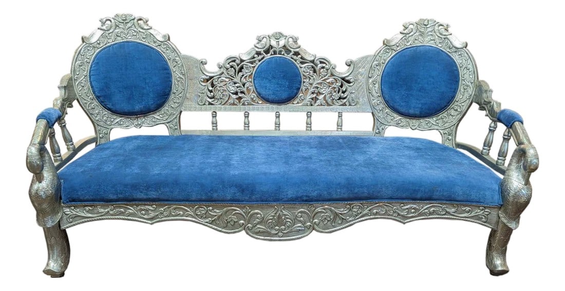 1970s Indian Ornate Silver Metal Clad Blue Velvet Maharaja Bench: Step into a world of regal splendor and timeless heritage with this breathtaking Vintage Hand Carved Maharaja Sofa. Once a prized possession of an Indian royal family, this 76 inch sofa serves as a