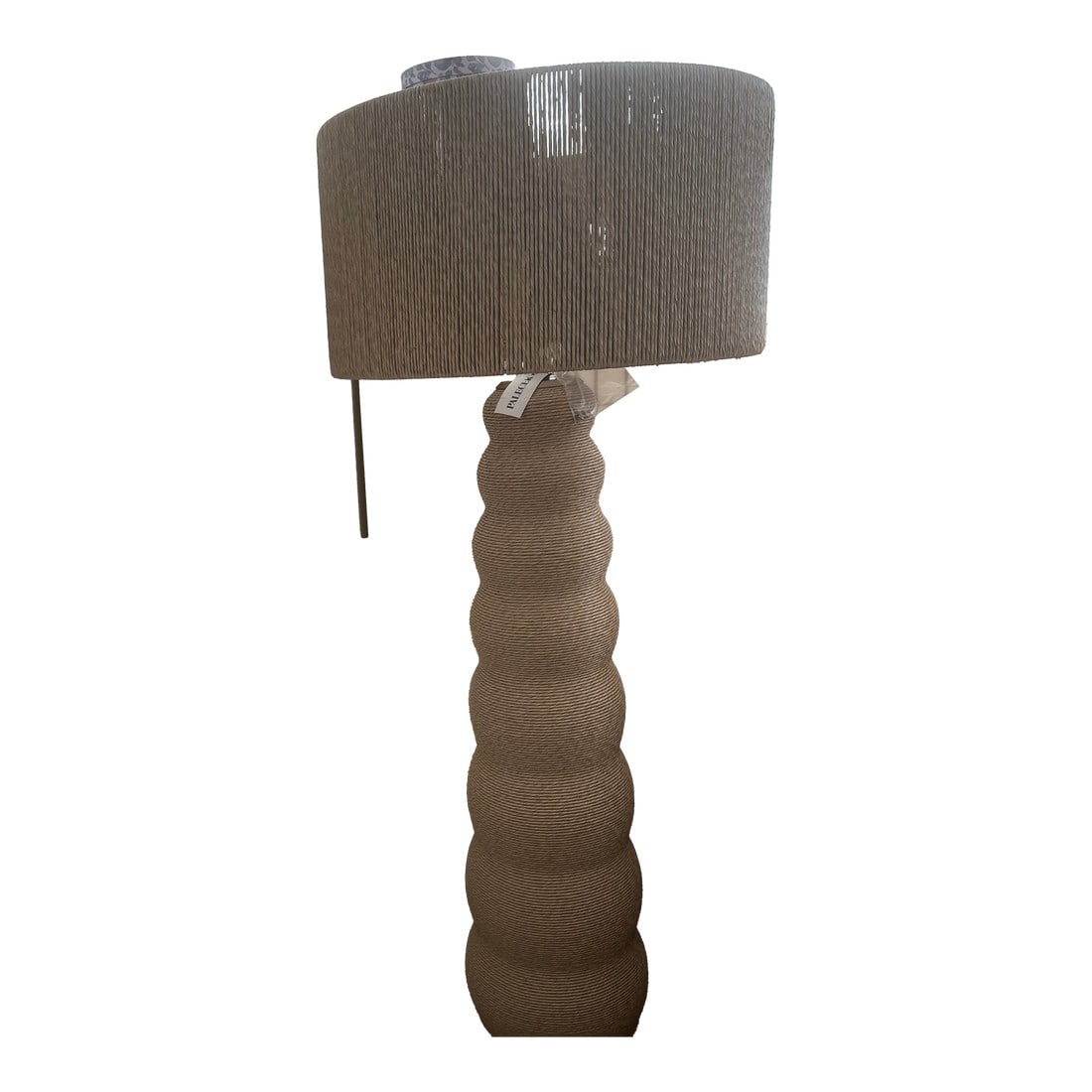 Palecek Kona Outdoor Floor Lamp: The Kona Outdoor Floor Lamp is perfect in any outdoor space. All weather synthetic rattan hand-twisted and wrapped over base and shade accented with brass-finished hardware, top cap and base. Weave