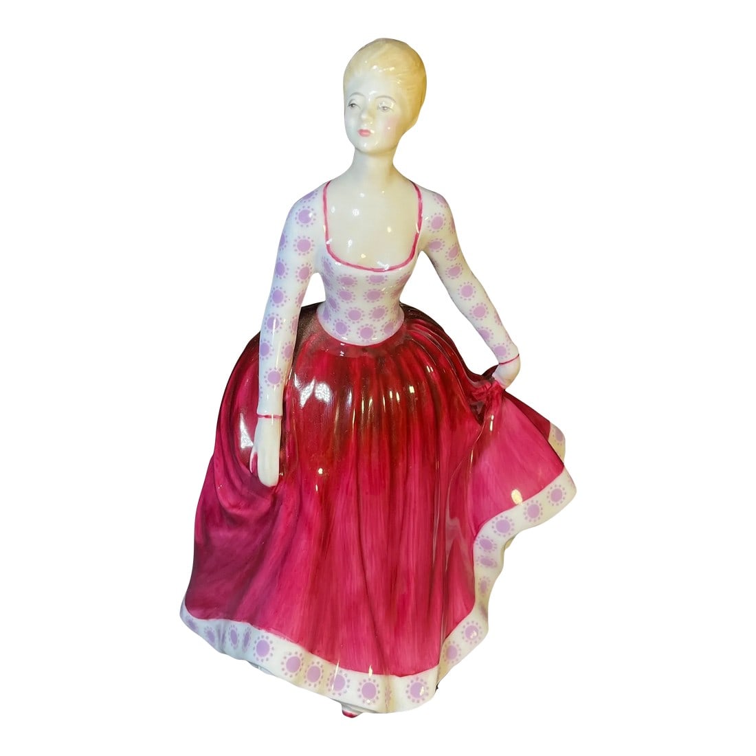 1970s Royal Doulton Porcelain Figurine, Fiona Hn2694: A figure of a young lady in a magenta skirt and pink floral top. Royal Doulton backstamp. Condition: Alterations: Original Condition Unaltered Imperfections: Some Imperfections Condition Notes: Age