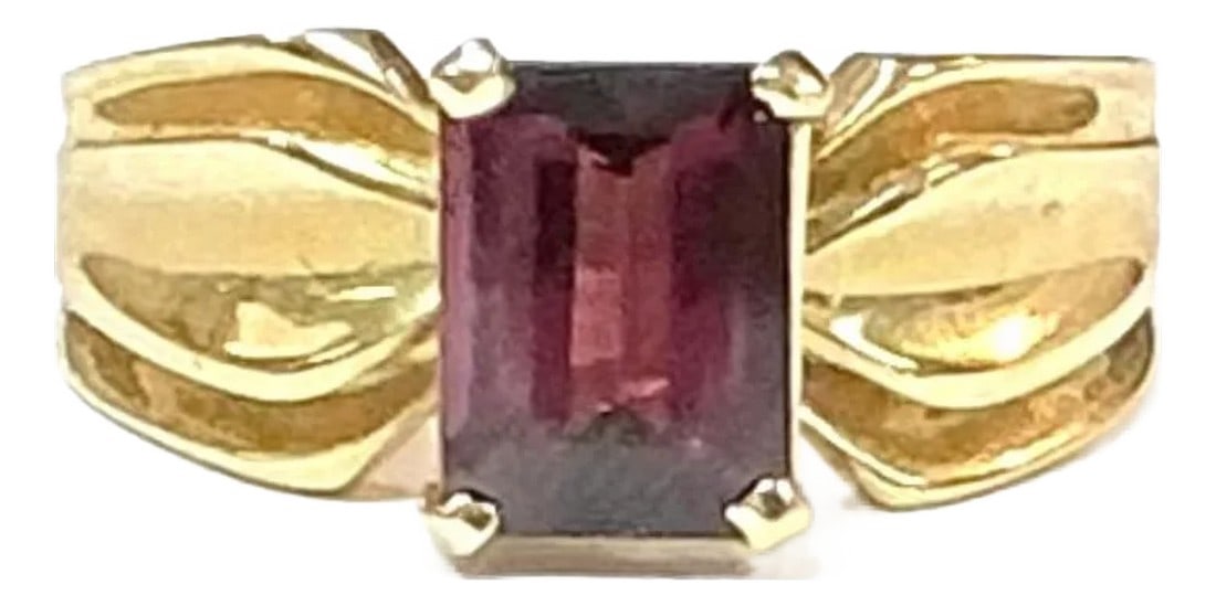 1.5 Ct Garnet 14k Yellow Gold Ring: 14k yellow gold emerald cut Garnet ring, 4.10 Grams TW. The dimensions of the emerald cut garnet are approximately 7.5 mm x 5 mm. Approximately 1.5 carats. Marked 14K. Approximate size 6.5.