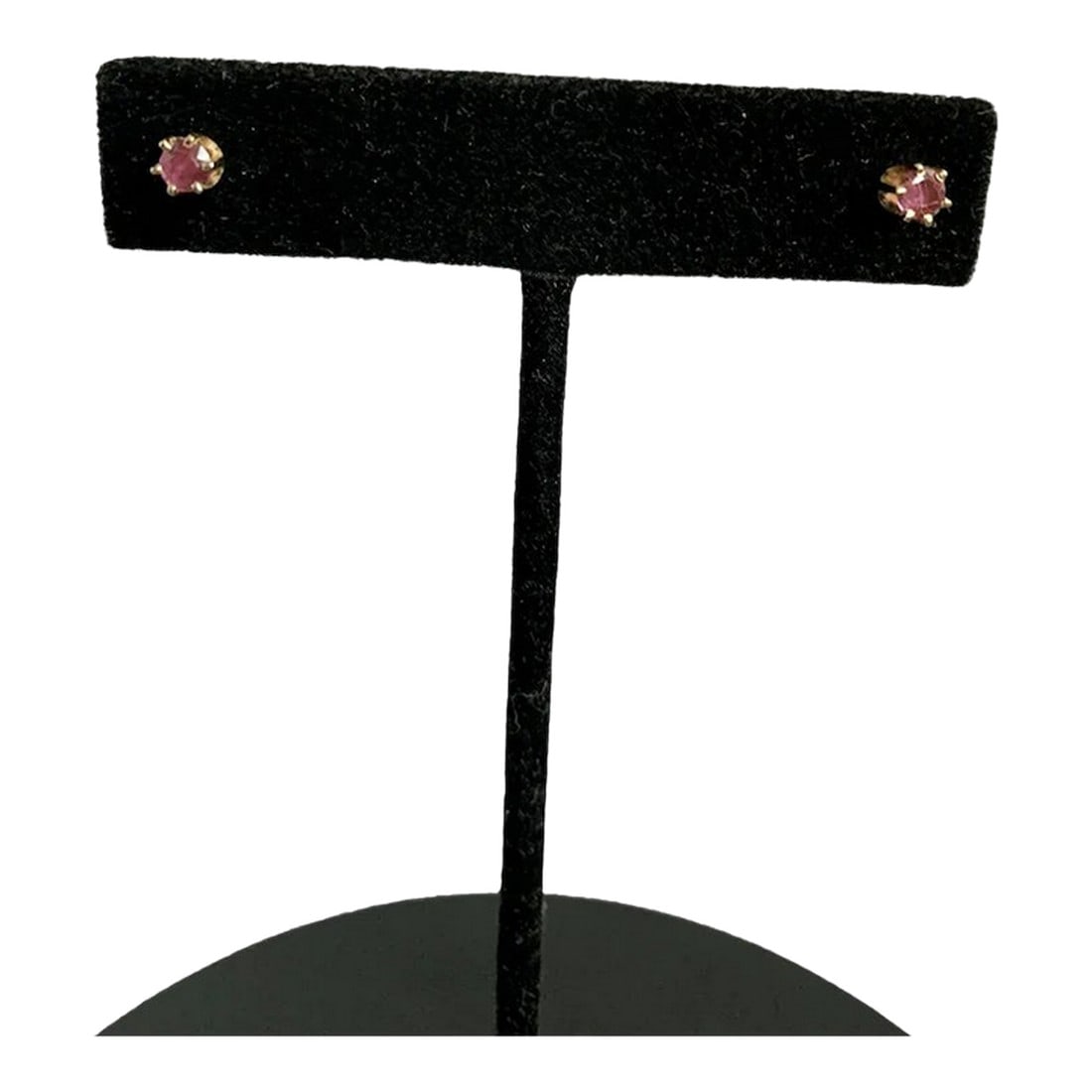 1980s 14k Ruby Stud Earrings, A Pair: Simple and elegant 14k yellow gold and ruby stud earrings. Measure 3/8" across, and each earring is approximately 1/4 karat. Secure silicone backs. There are two earrings in this set. Condition: