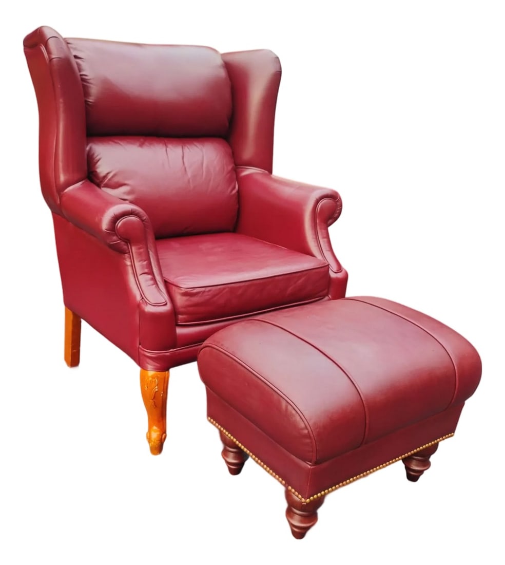 Classic Leather Wingback Chair and Ottoman Set: Experience timeless elegance and unparalleled comfort with the exquisite Classic Leather wingback chair and ottoman set. Crafted with smooth, rich burgundy leather, this set features classic design