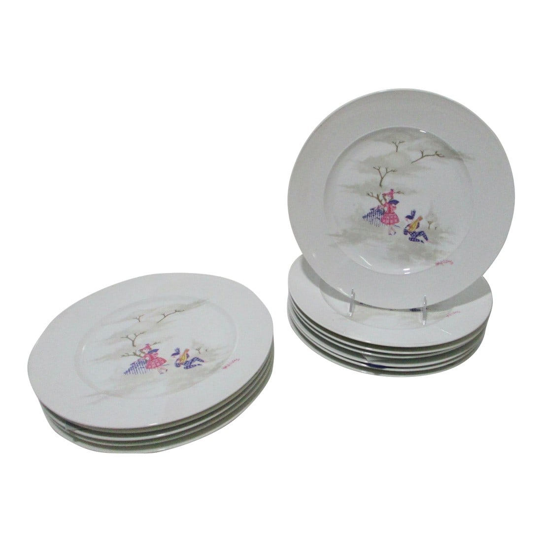 Mid 20th Century Rosenthal Dinner Plates by Bjorn Wiindblad - A Set of 12: Rosenthal Bjorn Wiinblad Set of 12 dinner plates measuring 11" in diameter. In a retelling of Pirot and Pirette, the little characters engage in a romantic moment by the fence. Hallmarked on the