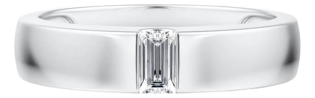 Tension Set Platinum Wedding band with Emerald Cut diamond: Tension set wedding band in a brushed satin platinum finish, featuring a tension set emerald cut diamond. This piece has the following specifications; Color and Clarity; E VVS2. Total Carat weight: