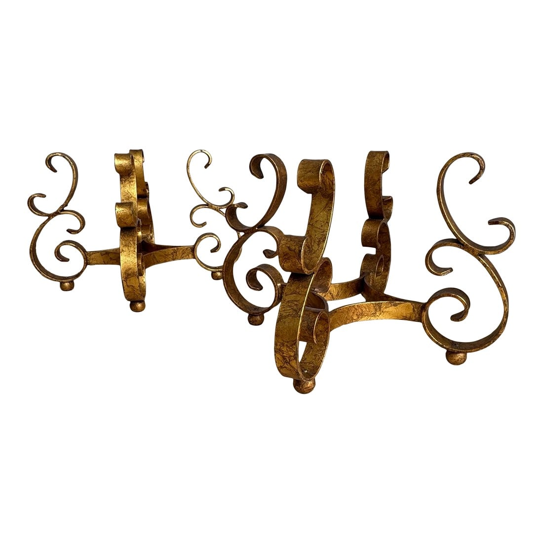 Wonderful Pair of Sculptural Wrought Iron Side Table or Ottoman Bases With Gilt Finish Circa 1960s: Beautoful and rare matched pair of heavy, handcrafted wrought iron table bases featuring bold scrollwork and an original antiqued gilt finish with darkened undertones. These sculptural bases date to