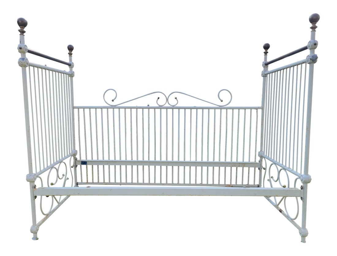 Early 20th Century Vintage Iron Daybed: Incredible vintage iron daybed, beautiful details through out. Perfect for a sitting room or a lovely addition to home office. Measures 31D x 53T x 65W Notes: marks, scratching, slight rust ~