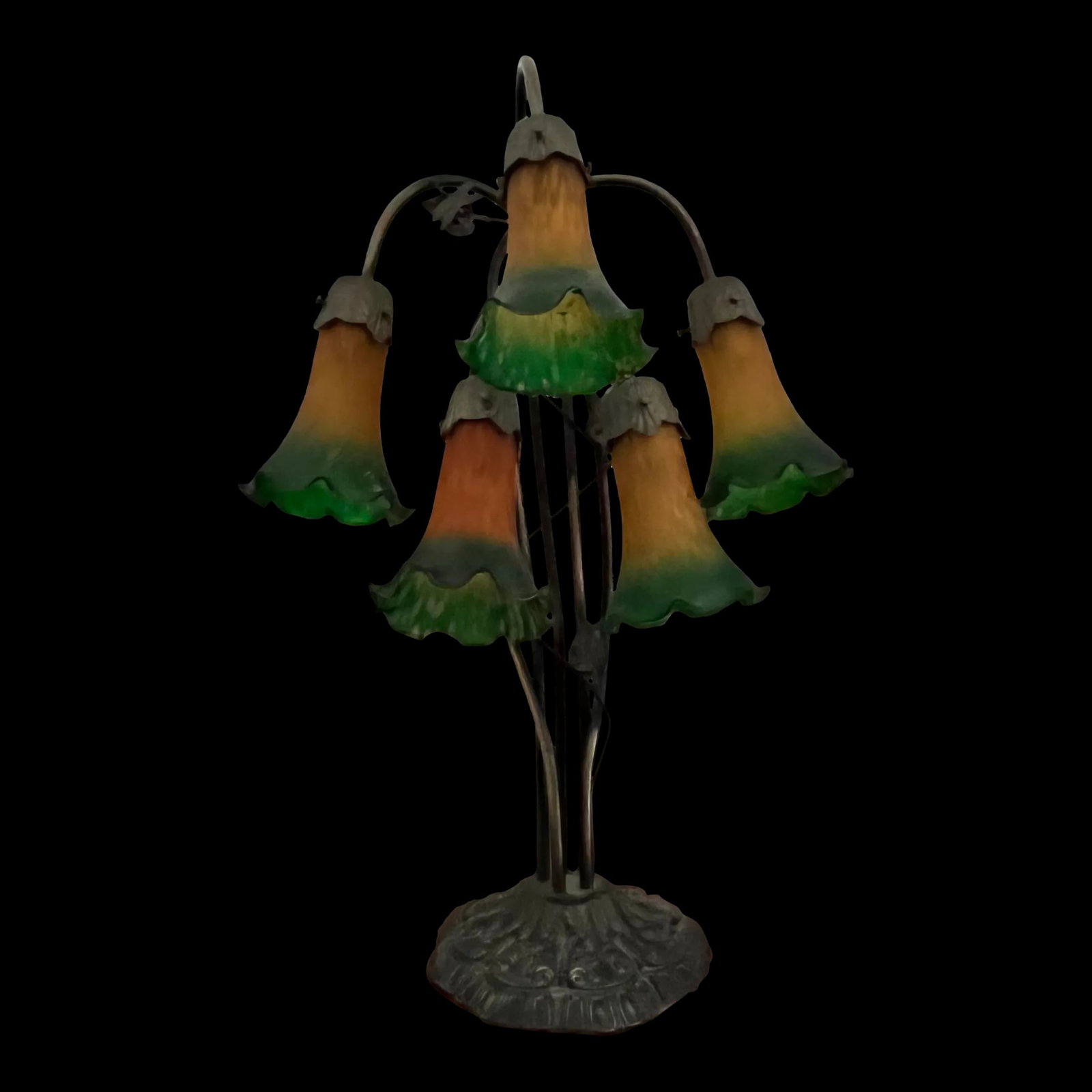 Vintage Five Light Trumpet Shade Lamp: Exceptionally well cared for trumpet shade lamp with five lights. Each shade is amber graduating to green on the ends. The bronze finish base (8" diameter)has a baroque design with a branch holding