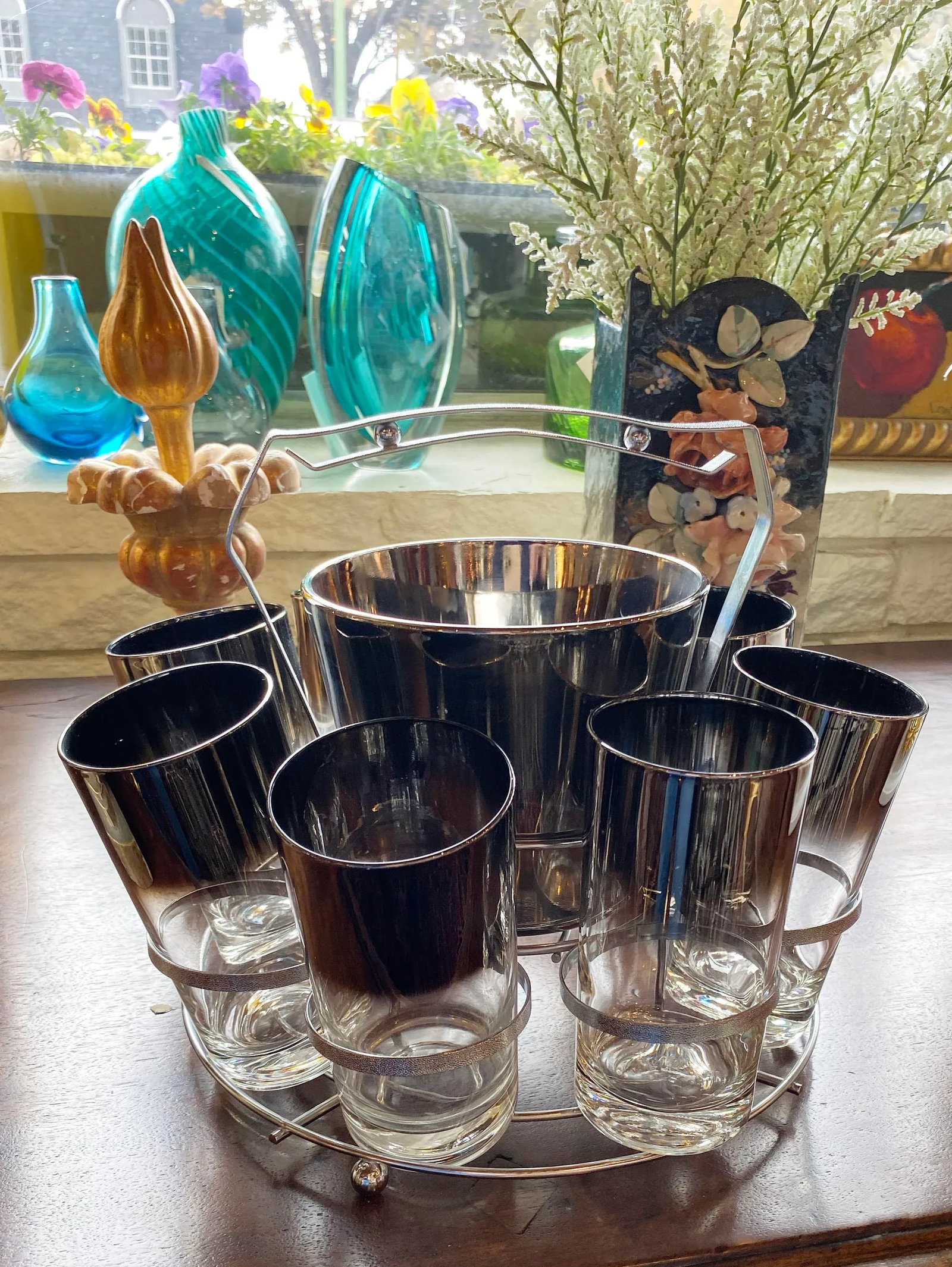 Mid 20th Century Dorothy Thorpe Glassware Set - Set of 10: Serve up some fun with this retro Dorothy Thorpe eight glasses set with silver trim and a matching ice bucket in a convenient ready to carry round caddy. 12" Diameter x 9" High Condition: