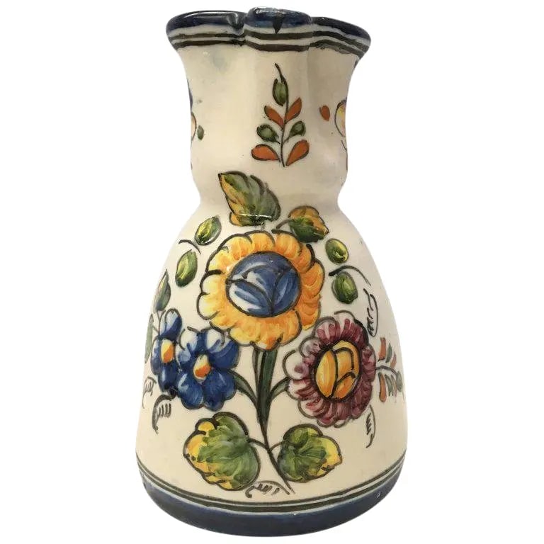 19th Century French Glazed Terracotta Pitcher Handmade & Hand-Painted: About 19th century French glazed terracotta pitcher with beautifuls fleurs. Details PRODUCTION TIME Available Now OF THE PERIOD Spanish Colonial PLACE OF ORIGIN Spain DATE OF MANUFACTURE 1920 PERIOD